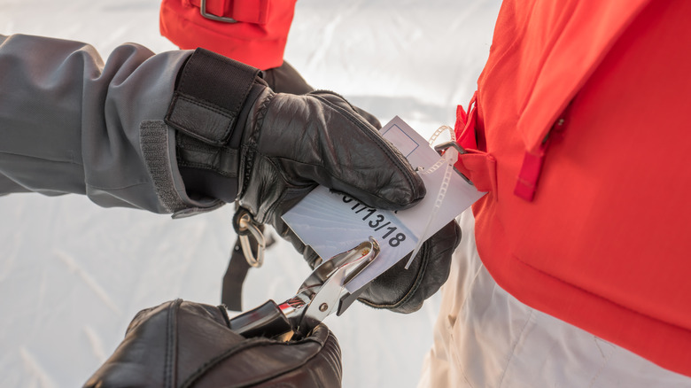 A skier getting their ticket punched up