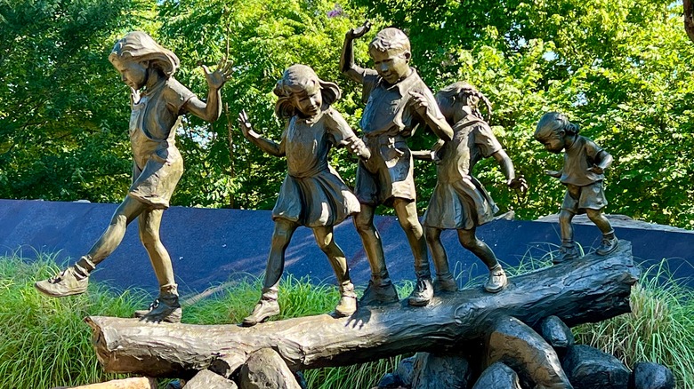 statues of children in park