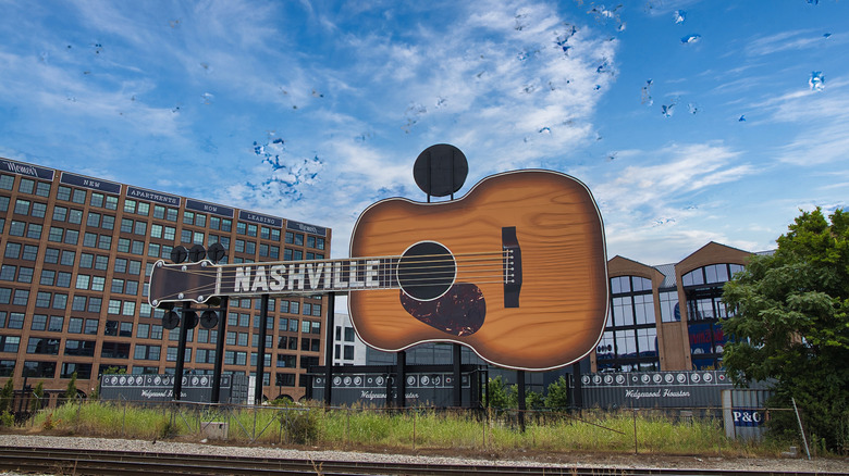 Downtown Nashville with a guitar statue on a sunny day