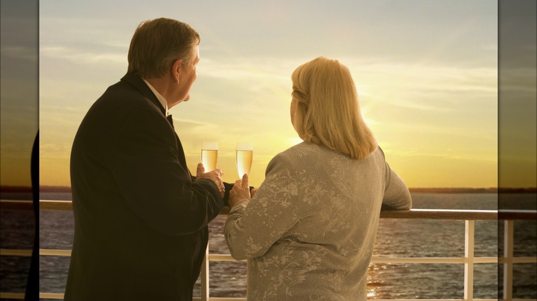 couple with wine at sunset