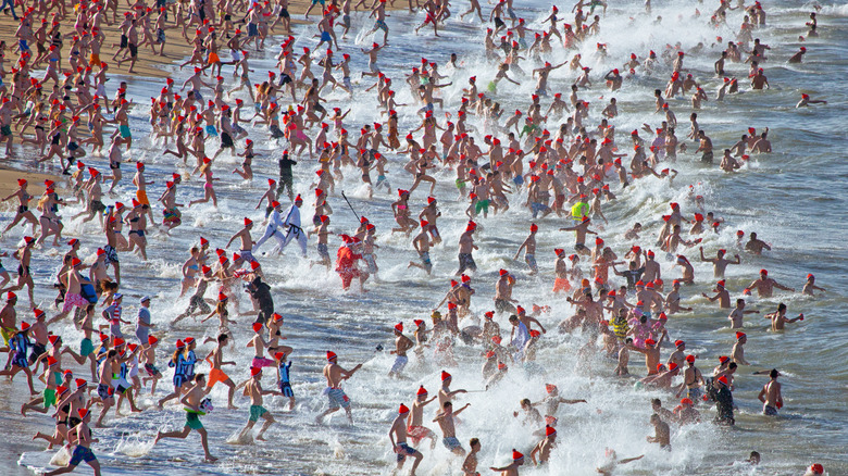 People in Scheveningen run into the water on New Year's Day