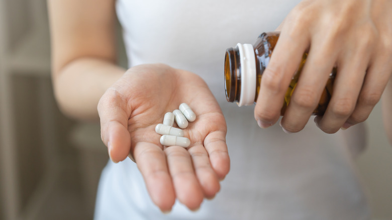 Woman taking supplements