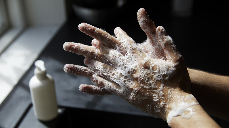 Person washing hands thoroughly