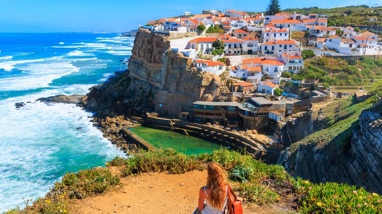 A woman looking at the coastal views of Azenhas Do Mar