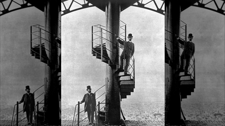 Gustave Eiffel and friend on steps near Eiffel Tower apartment