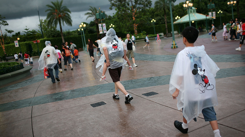 Disney goers walking in the rain in Shanghai