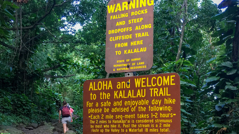Warning signs at hiking trailhead