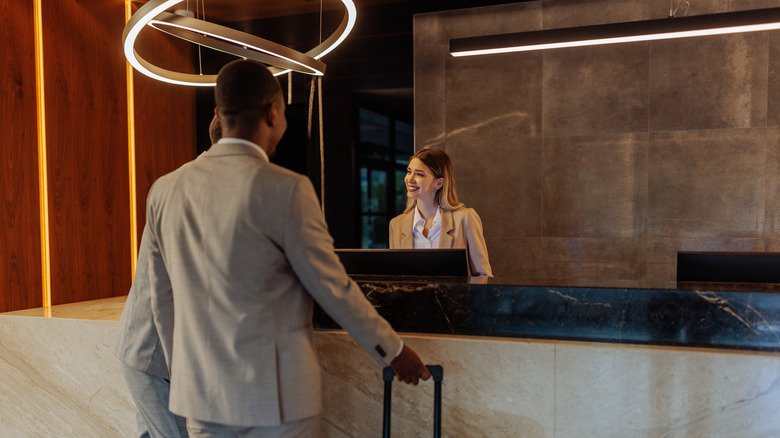 Person checking into a hotel