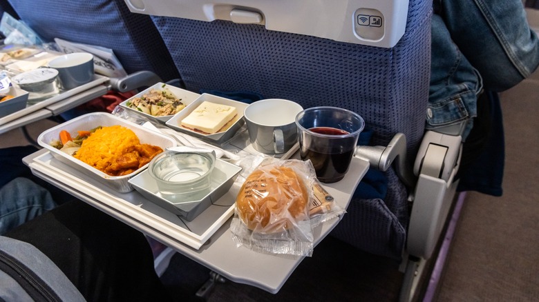 asian meal on airplane tray