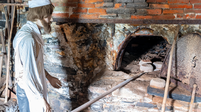 mannequin at ancient bread oven