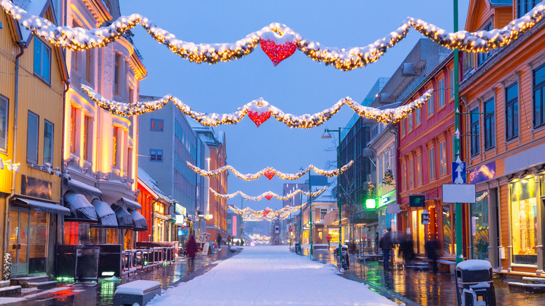 Snowy streets in Tromso, Norway, decorated for Christmas