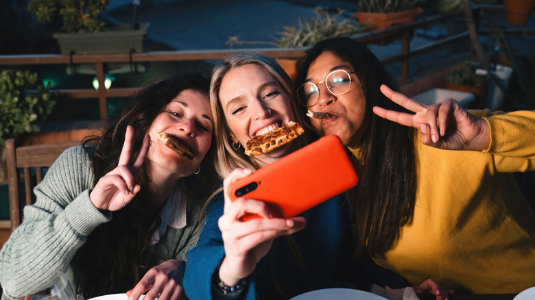 Friends on a food tour taking a selfie