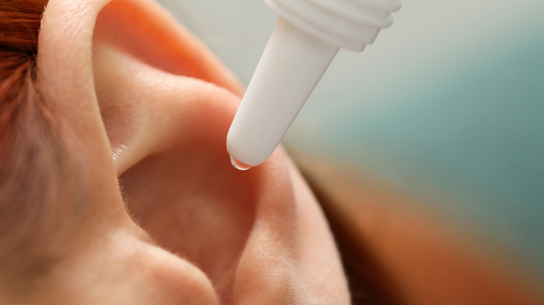 Person using ear drops