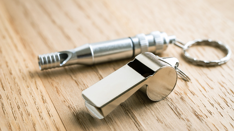 Emergency whistle on table