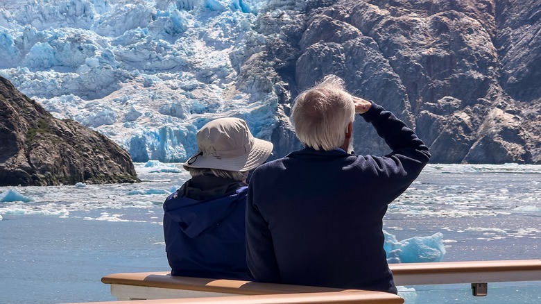 Elderly couple looking at glacier