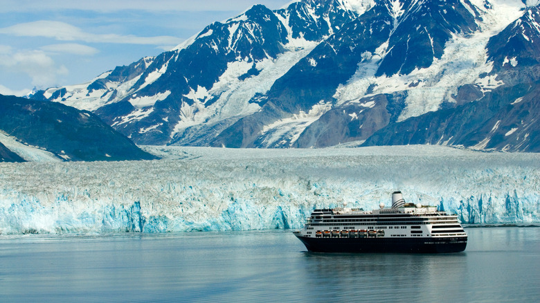 Cruise ship in front of glacier and mountains