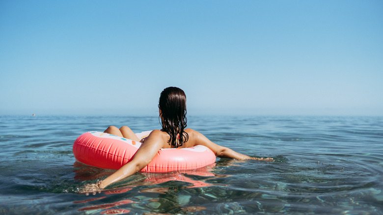 Woman in inflatable in ocean