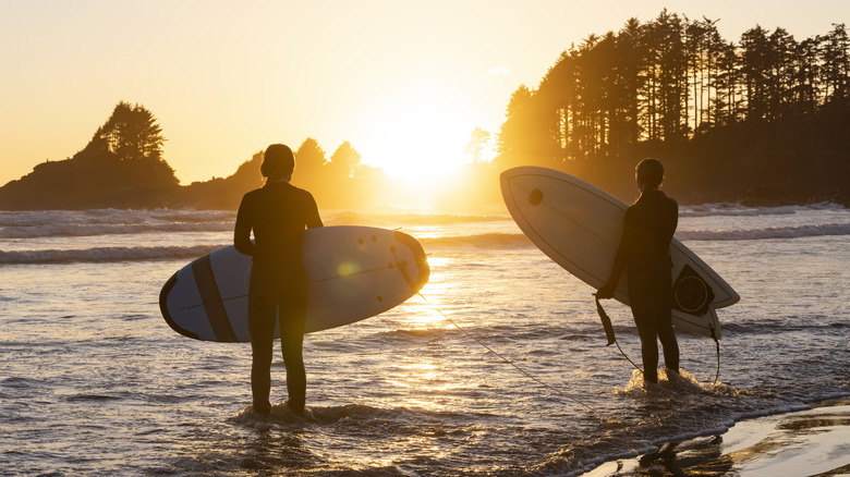 Surfers at sunrise