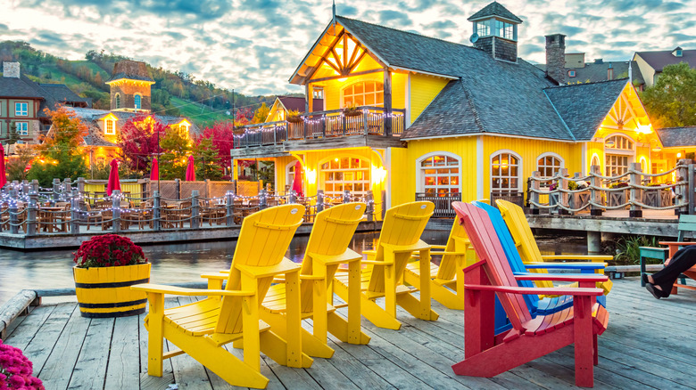 Blue Mountain Village restaurant patio and lake in summer.