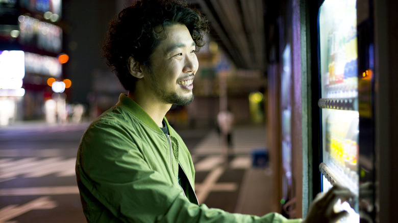 man using vending machine tokyo