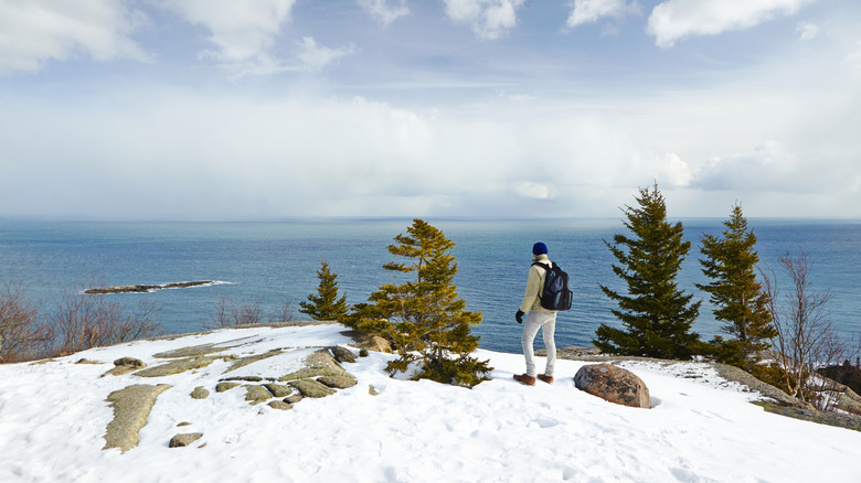 Person hiking in Acadia National Park in the winter