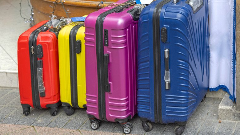 Colorful suitcases with four wheels
