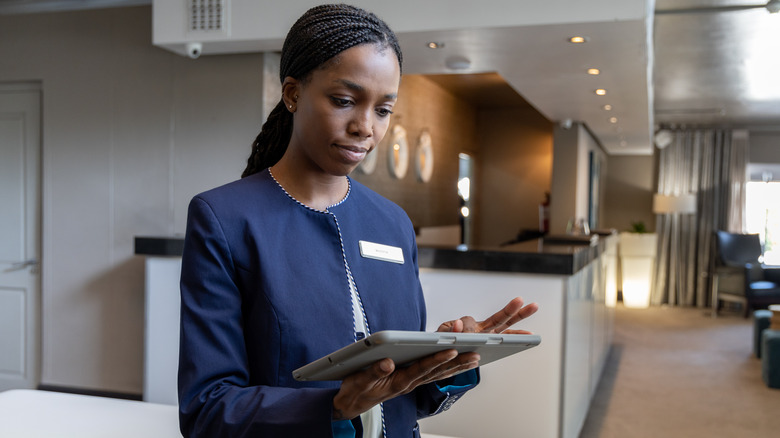 Hotel staff fixing reservations