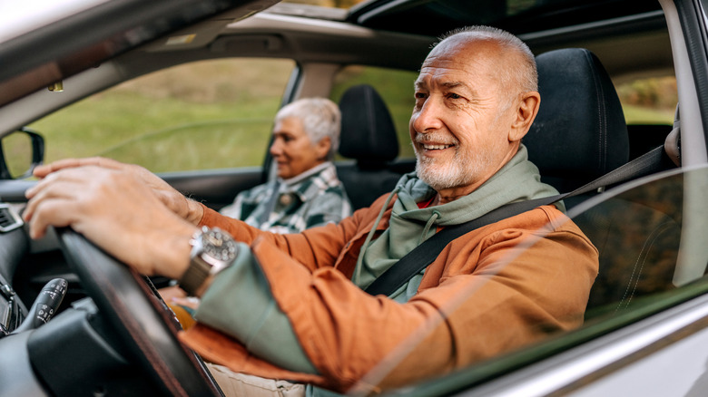 Older travelers driving in a car