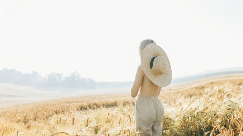 a person in only pants and a hat