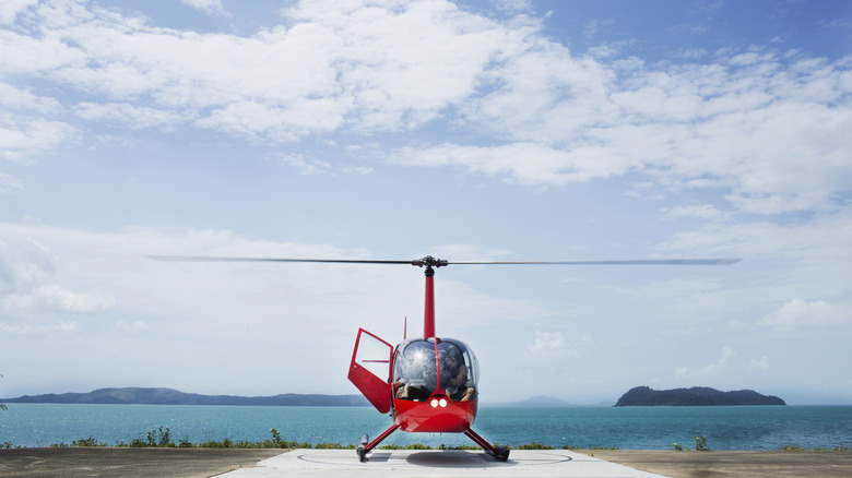 Tourist helicopter on a landing pad on an island