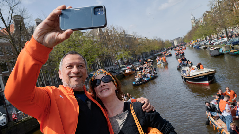 Vacationing couple taking selfie