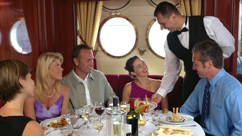 Guests being served food on a ship.