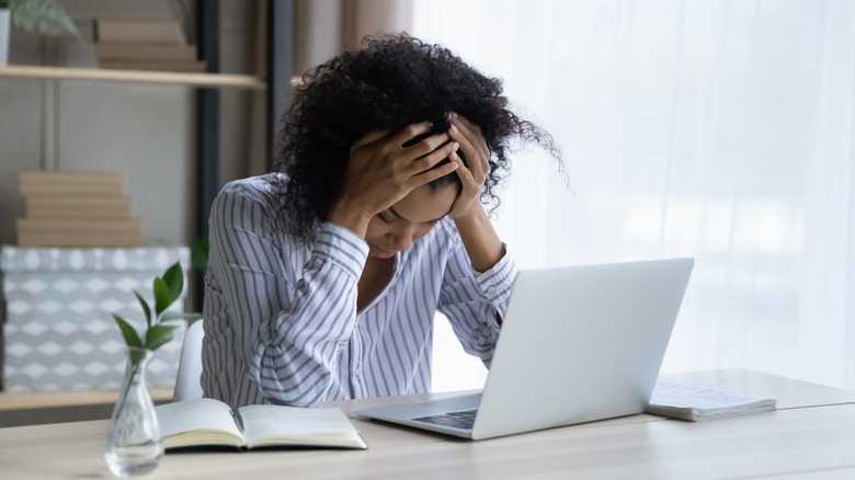 woman upset at computer