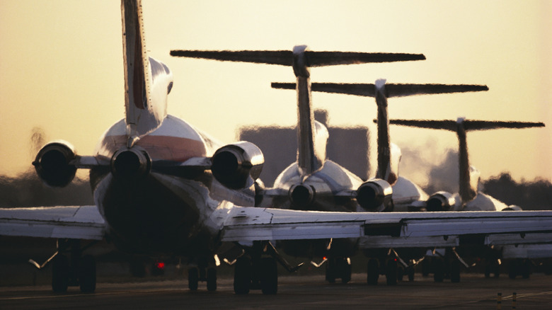 Airplanes backed up on runway