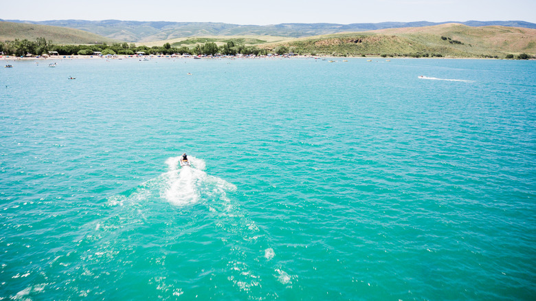 turquoise water boat sandy beach