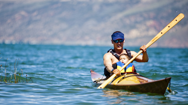 man baby kayak bear lake blue