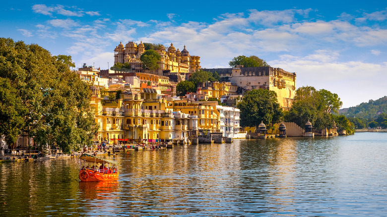 Aerial view of City Palace and Lake Pichola on a sunny day