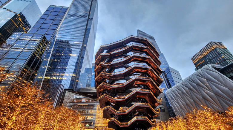 The Vessel at Hudson Yards in New York City with golden-lit trees