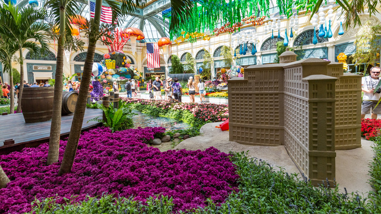 Bellagio Conservatory and Botanical Gardens display with palm trees and small model of the resort