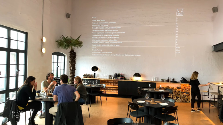 Interior of Silo restaurant with menu projected on the wall