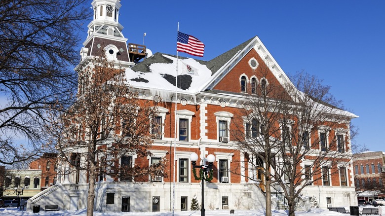 Macomb historic courthouse in the winter with American flag