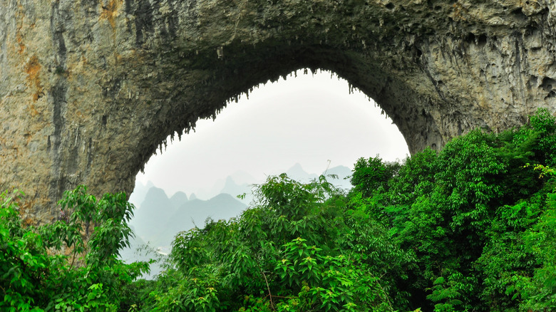 Natural arch within a mountain in Guangxi, China