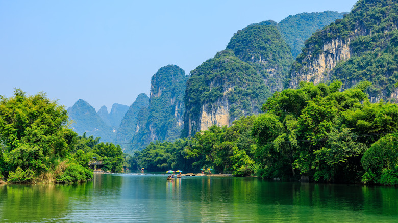 River and karst mountains covered in verdant foliage in Guangxi, China