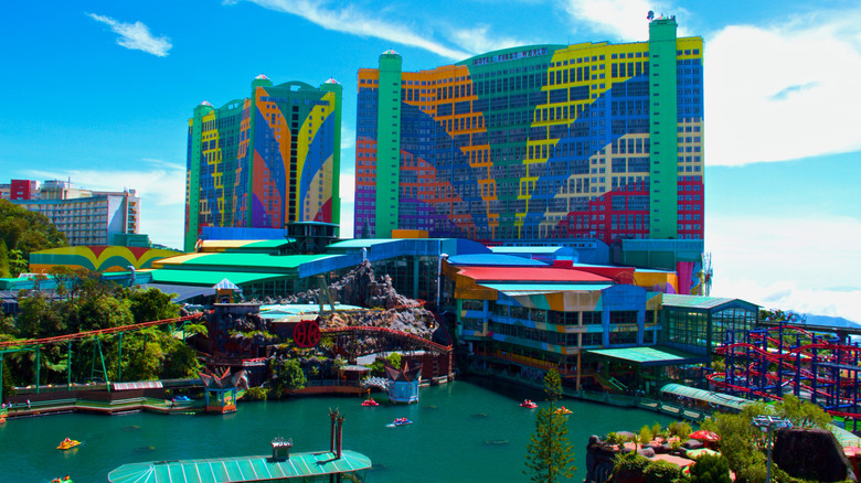 colorful facade of First World Hotel in Malaysia with theme park, lake, and towers