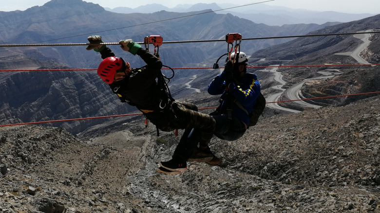 People prepare to zipline at Jas Flight