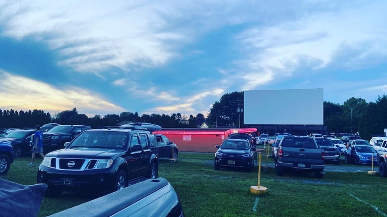 Cars sit on the field in front of the screen at Shankweiler's drive-in theater