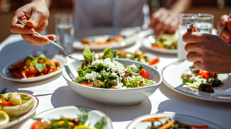 Diners enjoying vegetarian food in a restaurant