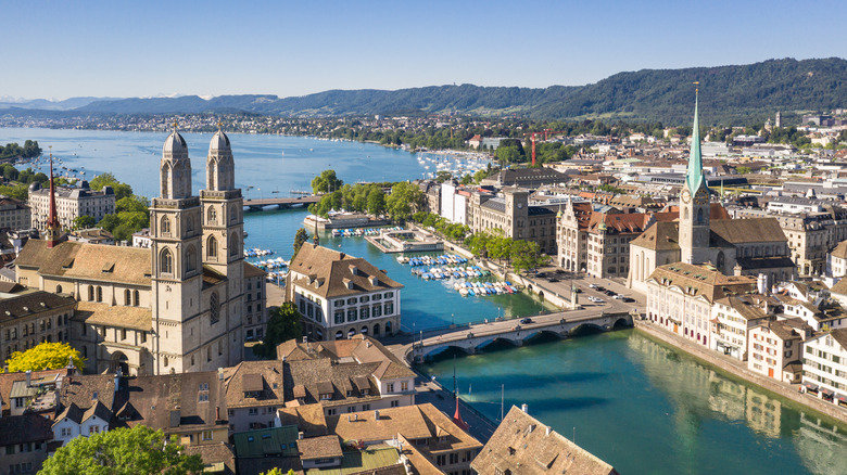 Aerial view of zurich old city with church spires, lake and river