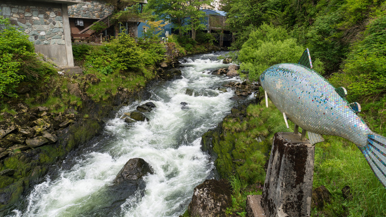 A salmon statue and falls along Ketchikan Creek