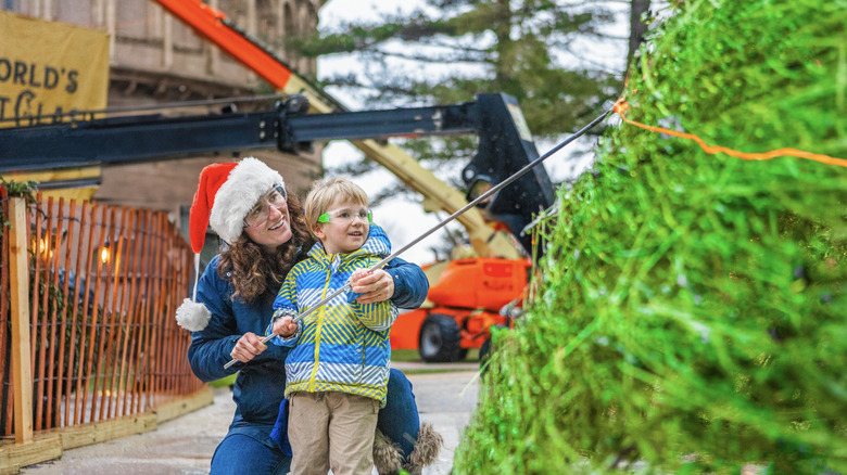 Woman and child next to World's Tallest Glass Tree